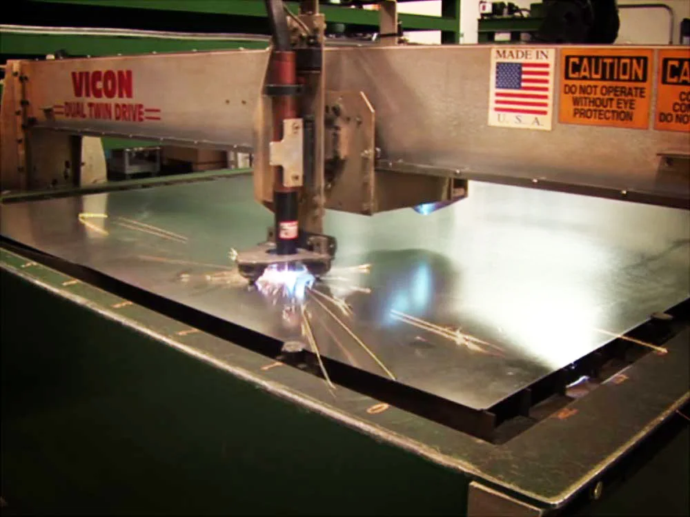 Plasma table for precision metal fabrication