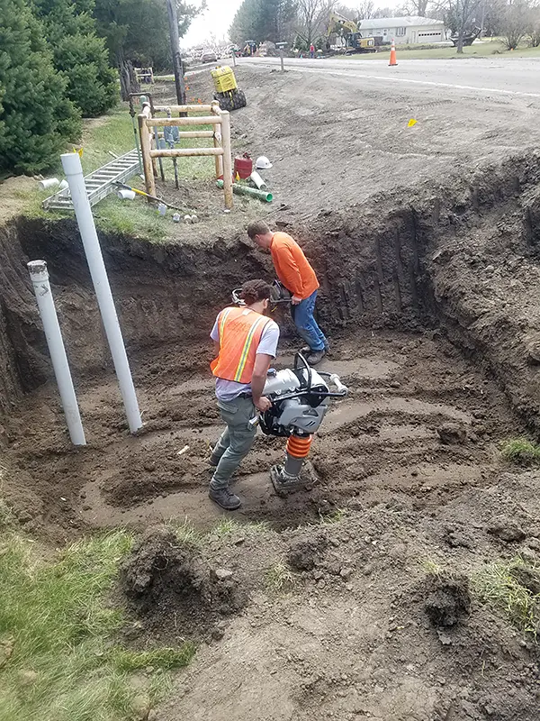Tamping trenches and around pipes